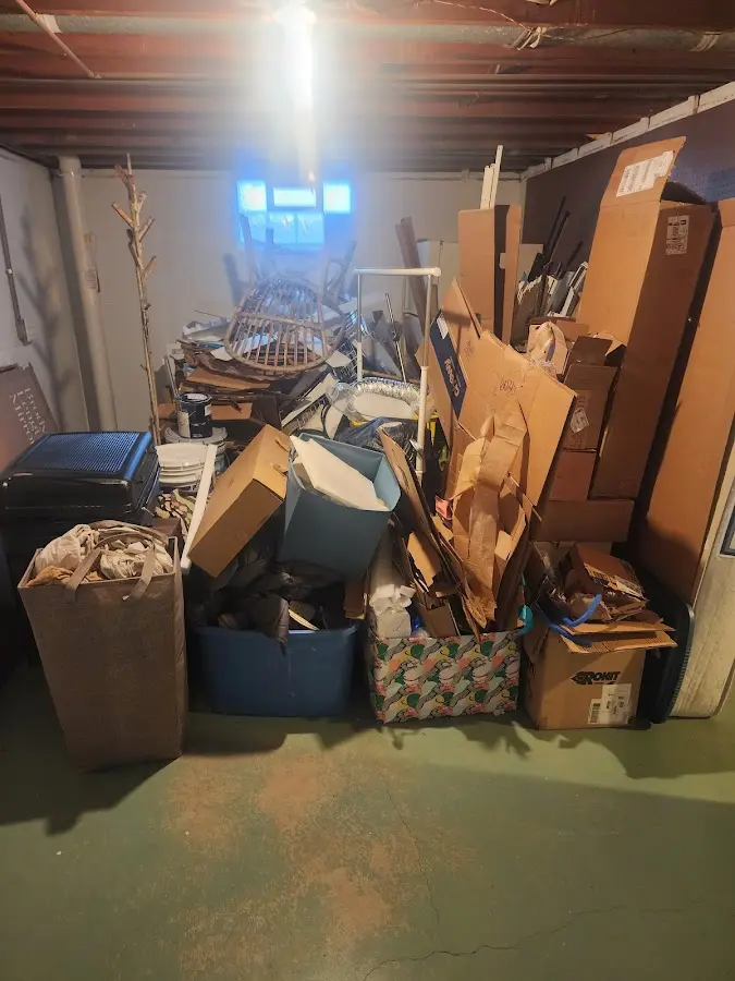 Roll-off dumpster container at job site for 2 Yard Dumpster Rental in Hidden Meadows